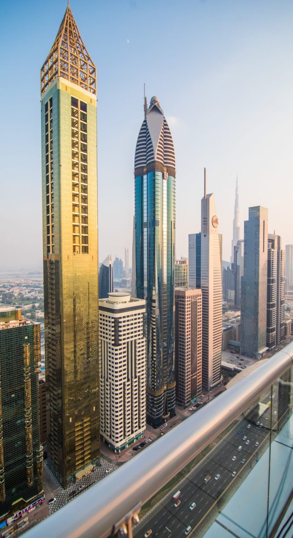 Scenic aerial view downtown Dubai, United Arab Emirates with skyscrapers and highways. Colourful travel background.